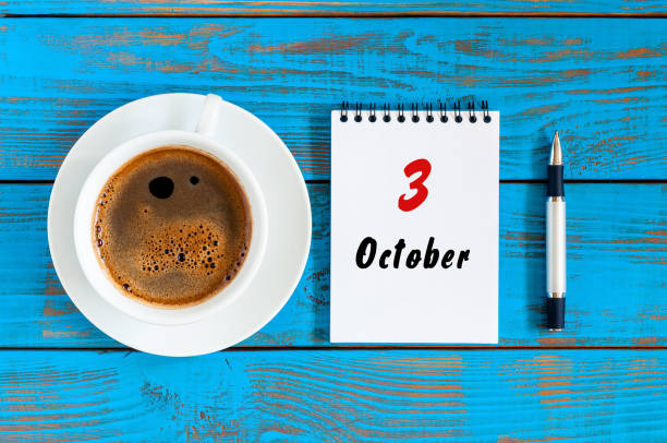 istock October 3rd. Day 3 of october month, calendar on notepad with morning cup coffee or at student workplace background. Autumn time 846476456