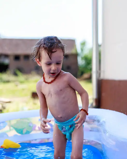 Male child plays in the water