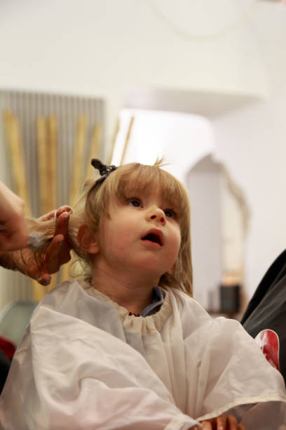 First haircut Boy gets a new haircut körperpflege stock pictures, royalty-free photos & images