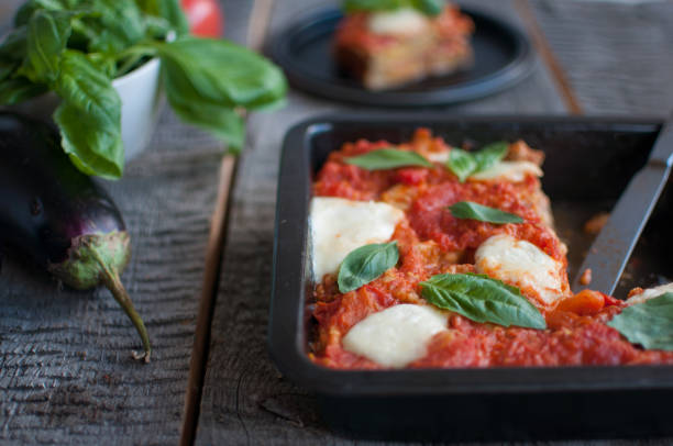 Italian dish with sliced eggplant filling, layered with mozzarella and tomato sauce stock photo
