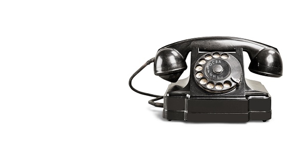Retro black telephone isolated on white background