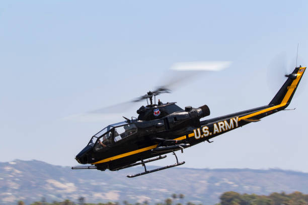 Helicopter UH-1 Cobra Army attack chopper Camarillo, California,USA- August 19,2017. Helicopter UH-1 Cobra fighter aircraft at the 2017 Camarillo Airshow outside of Los Angeles. The 2017 Camarillo Airshow features 2 days of aerial performances of vintage aircraft. uh 1 helicopter stock pictures, royalty-free photos & images
