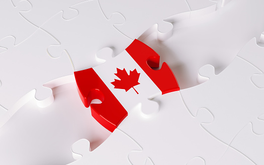 High quality 3d render of a jigsaw puzzle textured with Canadian flag. Canadian flag textured puzzle is forming a bridge between white puzzles. Teamwork and Bridging Concept. Horizontal composition with copy space. Isolated on white background. Clipping path is included.