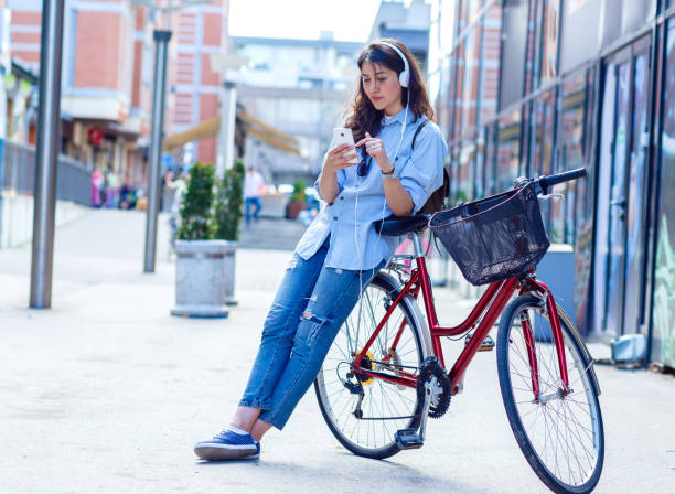 istock Beautiful young woman with bicycle in urban environment. 846488686