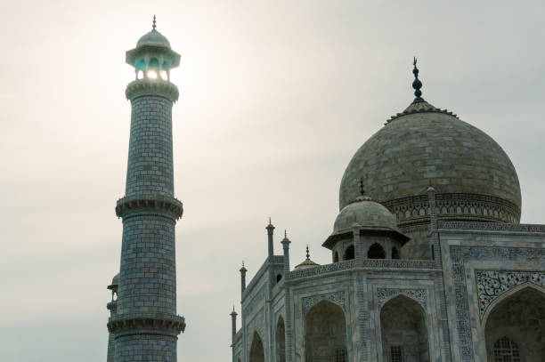 istock Taj Mahal dome and tower minar against sunset 846488900