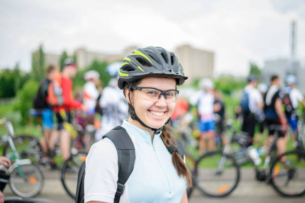 woman with bicycle at bicycle parade , portrait