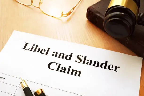 Photo of Libel and Slander Claims on a desk.