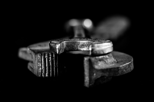 Rusty, old workshop keys. Hydraulic keys on a black table in a workshop.