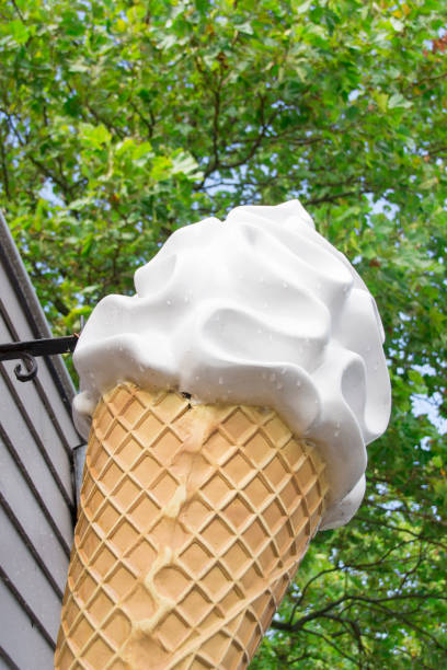 istock giant waffle cone with white ice cream on grey wall against green leave background 846499004