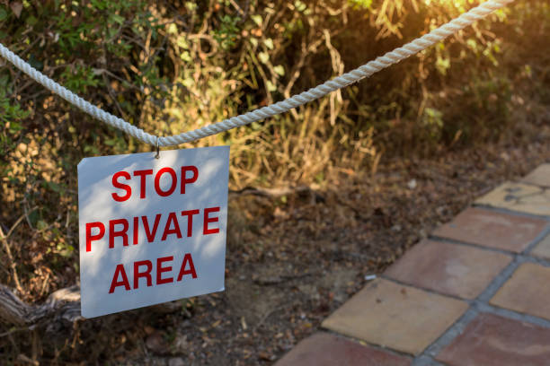 istock STOP Private AREA sign hanging on the rope 846502880