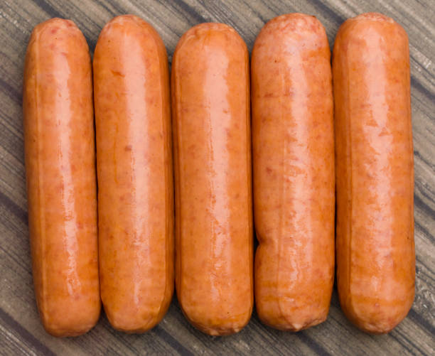 istock Hot Dogs Isolated on a Wooden Table 846517740