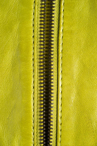 istock Green leather jacket zippers. Leather jacket macro details. Jacket zippers and pockets 846522200