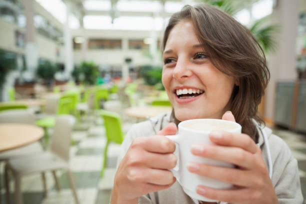 istock Cheerful student drinking coffee in the cafeteria 846522644