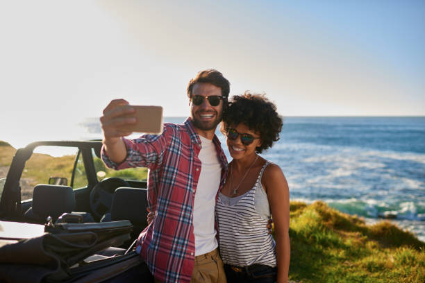 istock Young beautiful couple on roadtrip making selfie 846528478