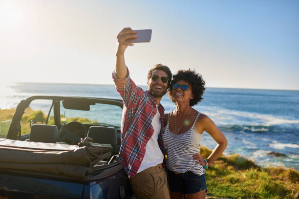 istock Young beautiful couple on roadtrip making selfie 846528552