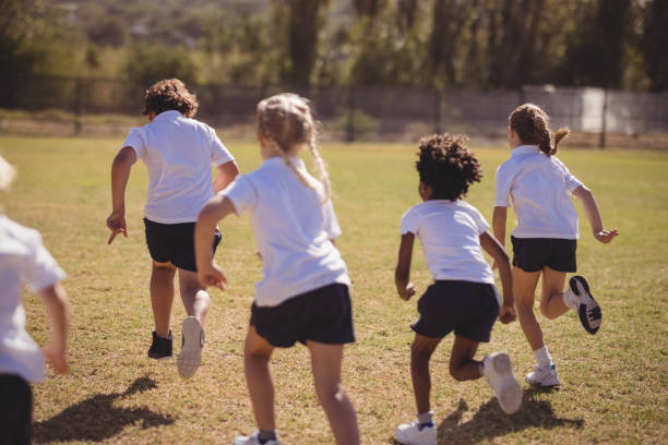 istock Schoolgirls running in park 846532222