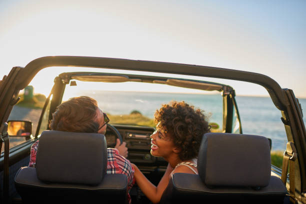istock Young couple sitting in their car during roadtrip 846540368
