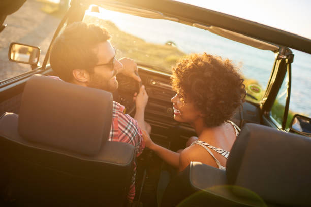 istock Young couple sitting in their car during roadtrip 846541430