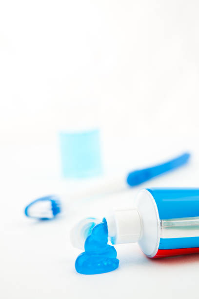 istock Blue toothbrush next to a tube of toothpaste 846543036