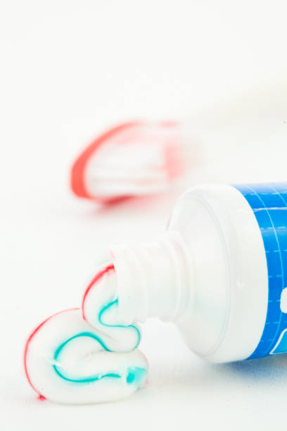 istock Blue tube of toothpaste next to a toothbrush 846543170