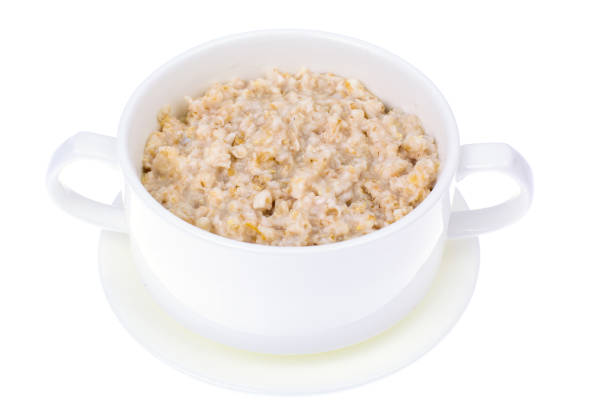 istock Oatmeal porridge in a white bowl, isolate 846548264