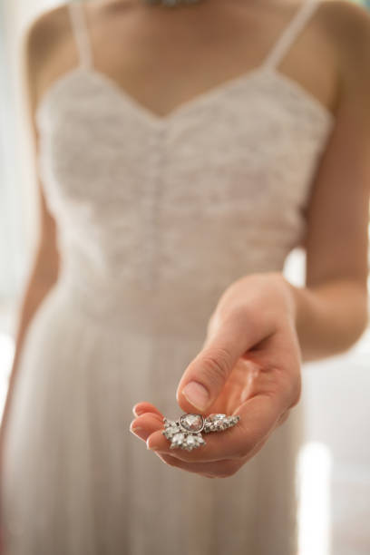 istock Midsection of bride holding necklace at home 846549452
