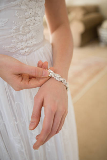 istock Midsection of bride wearing bracelet while standing at home 846549524