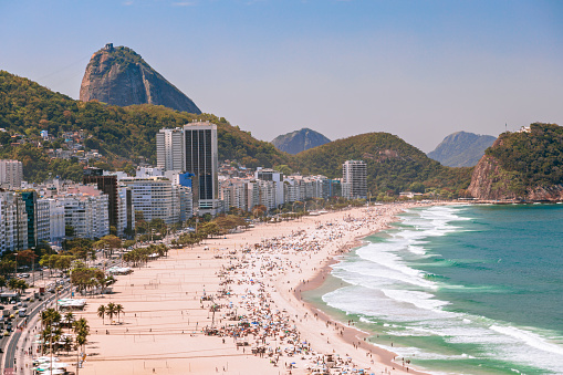 Beautiful view from the top of a hill of Bombas and Bombinhas beach, Santa Catarina state, Brazil. Crowded beach in a summer day. Atlantic Forest