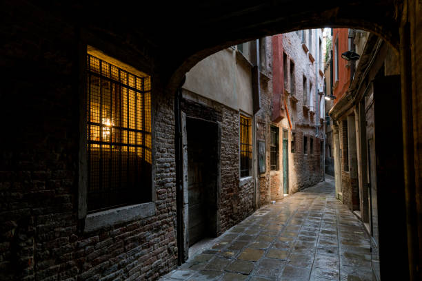 istock Dark twisty lane in Venice, Italy 846559078