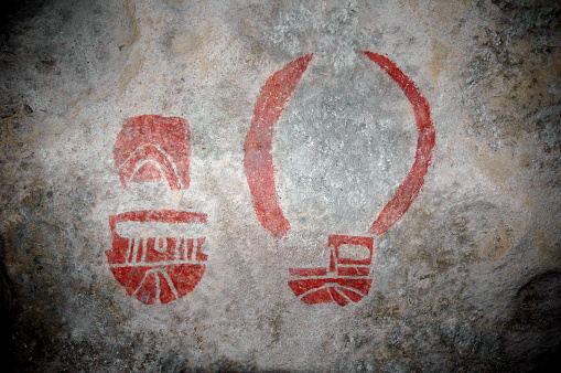 Colorful red mask from the Kiva Cave at Hueco Tank State Park in Texas.
