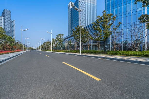 istock City empty road with modern buildings background 846564998