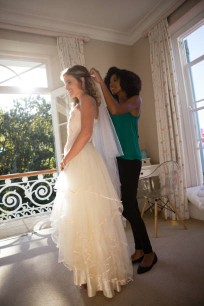 istock Beautician adjusting veil on bride hair 846573624