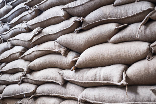 istock hemp sacks containing coffee bean in warehouse. stacked sacks in storehouse. 846573872