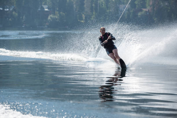 istock Beautiful woman waterskiing 846573960