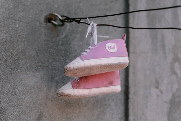 istock Old baby sneakers closeup photo 846580406