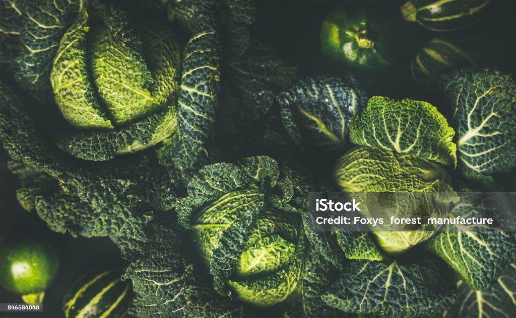 Raw fresh green cabbage texture and background Raw fresh green cabbage texture and background, top view over dark background, selective focus Cabbage Stock Photo