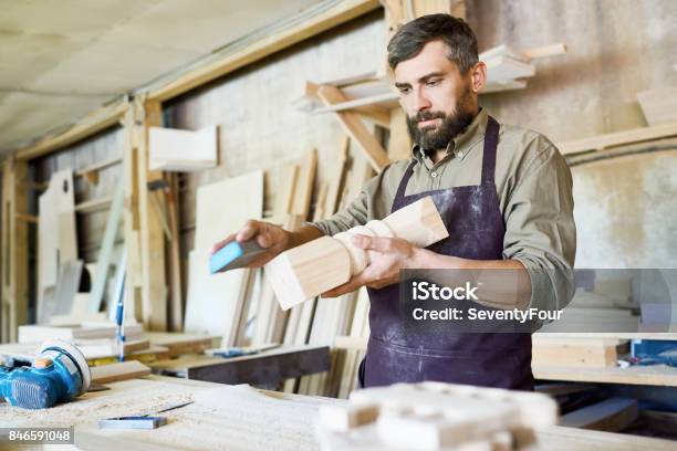Bearded Craftsman Wrapped Up In Work Stock Photo - Download Image Now - Craftsperson, Carpenter, Carpentry
