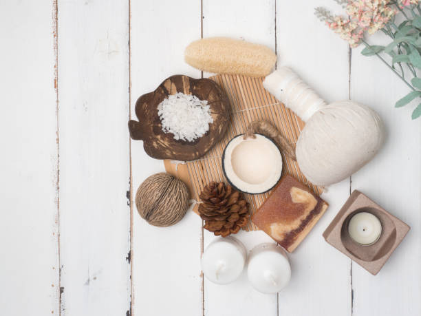 istock Spa set ,candle,coconut,flower,soap ,massage, with wood white background (top view) 846594560
