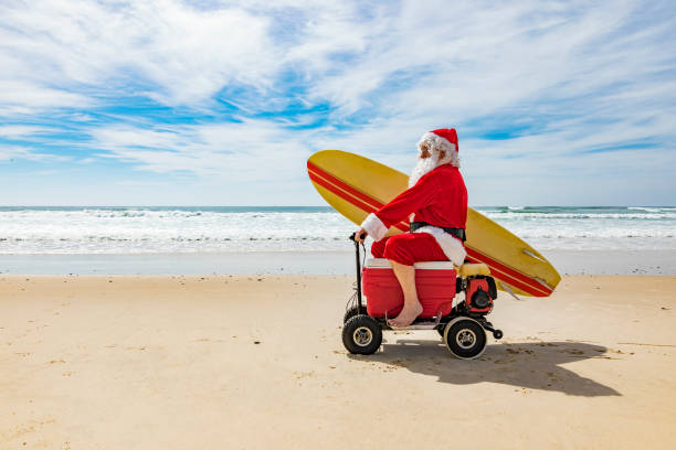 istock Santa Claus Riding a Motorised Esky Cooler on the Beach 846599272