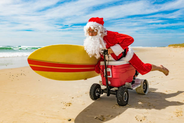 istock Santa Claus Riding a Motorised Esky Cooler on the Beach 846599274