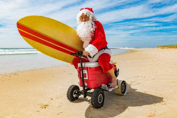 istock Santa Claus Riding a Motorised Esky Cooler on the Beach 846599298