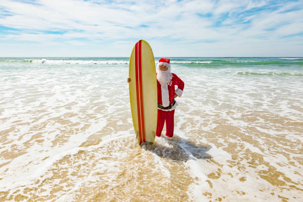 istock Surfing Santa Celebrating Summer Christmas at the Beach 846599304