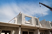 Installation process of prefabricated wall panels for residential buildings.