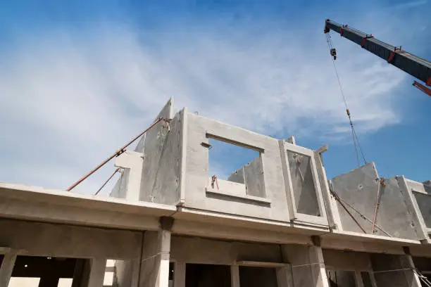 Installation process of prefabricated wall panels for residential buildings.