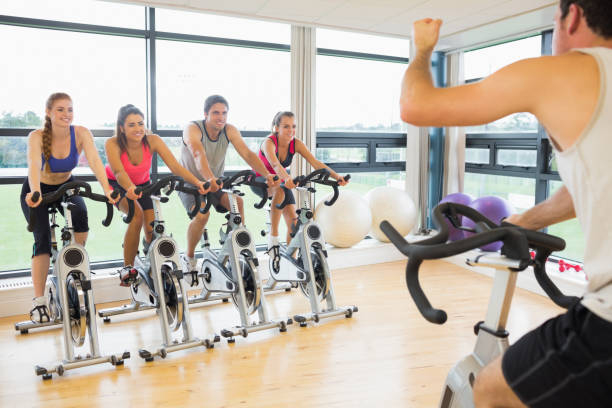 istock Man teaching exercising class to four people 846615892