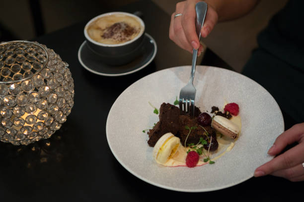 istock Woman having dessert and coffee at table 846625206