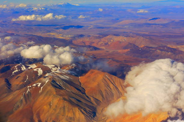 Atacama Desert – Chilean, Argentinean and Bolivian Andes aerial view – above dramatic snowcapped pastel colored landscapes, exotic volcanoes and Idyllic Atacama Desert, Volcanic landscape panorama – Chile, Bolivia and Argentina border desierto de atacama – chile, argentina y bolivia andes vista aérea – sobre el espectacular pastel nevado paisajes, volcanes exóticos y desierto de atacama idílico panorama de paisaje volcánico de colores – chile, bolivia y argentina la frontera