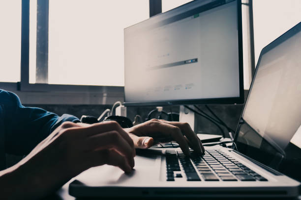 istock Close up of Male hands using computer on the desk. 846628954