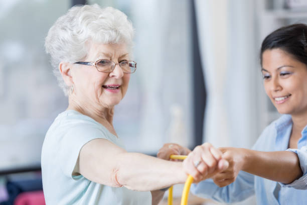 istock Confident senior woman uses resistance band in physical therapy session 846633162