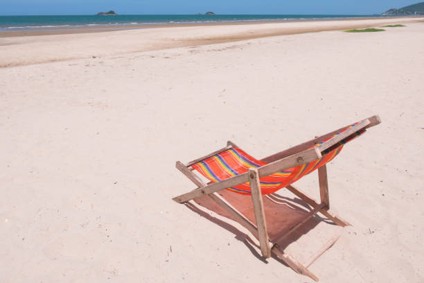 istock Red canvas chair on the beach. 846635888